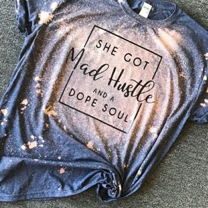 She got mad hustle and a dope soul tee